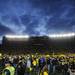 Michigan fans celebrate after leaving the stands and crowding the field at Michigan Stadium on Saturday. Melanie Maxwell I AnnArbor.com